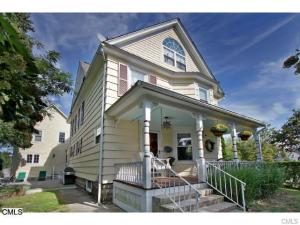 Charming front porch complete with swing and private back patio.
