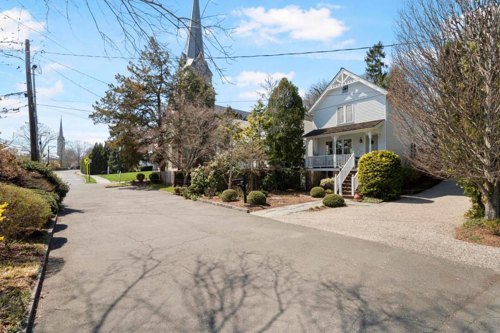 494 Pequot Court, Southport, view of house and church steeple from across the street.